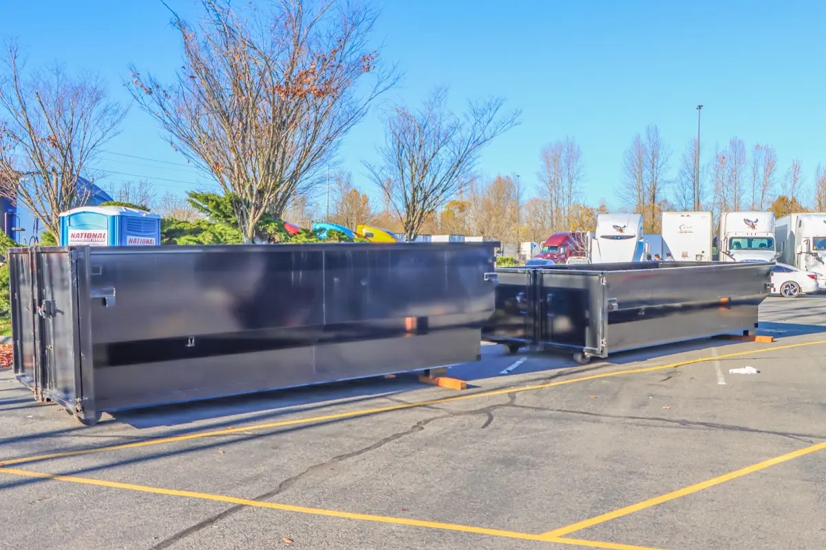 Professional dumpster rental service with roll-off container on residential driveway in North Lynnwood